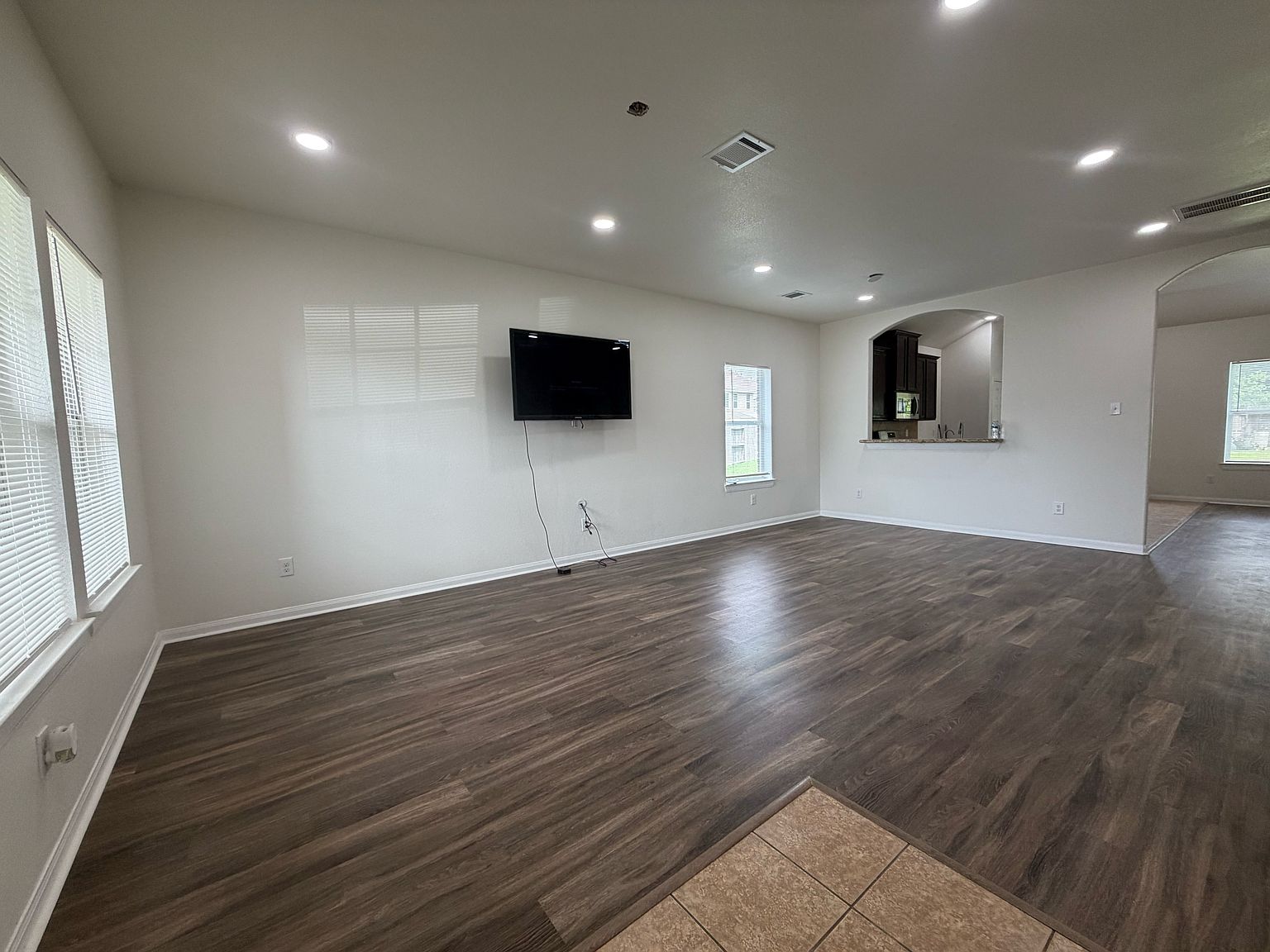 Open family room with hardwood floors